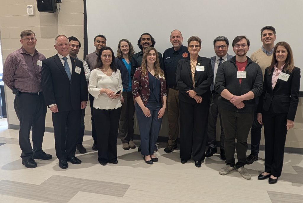 Photograph of panelists and faculty speakers.
