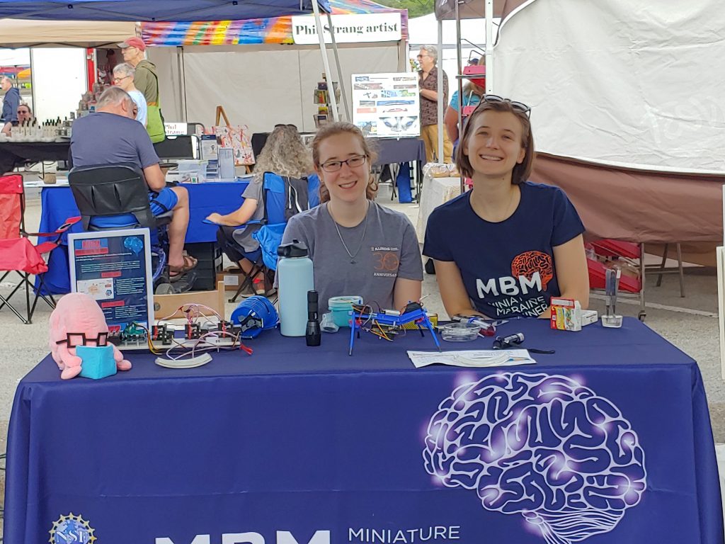Trainees Shannon Murphy and Whitney Sinclair at the MBM booth at the Urbana Farmer's Market