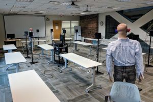 Conference room with microphone arrays and loudspeakers