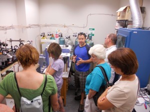 Mike explains his research to teachers during a lab tour.