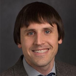 Headshot of lab director Ian Mertes.