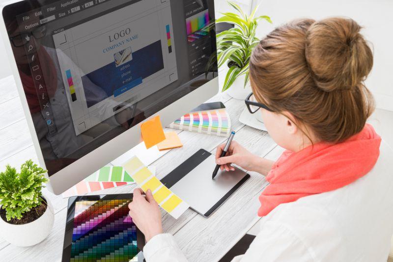 Student working at computer doing graphic design. 