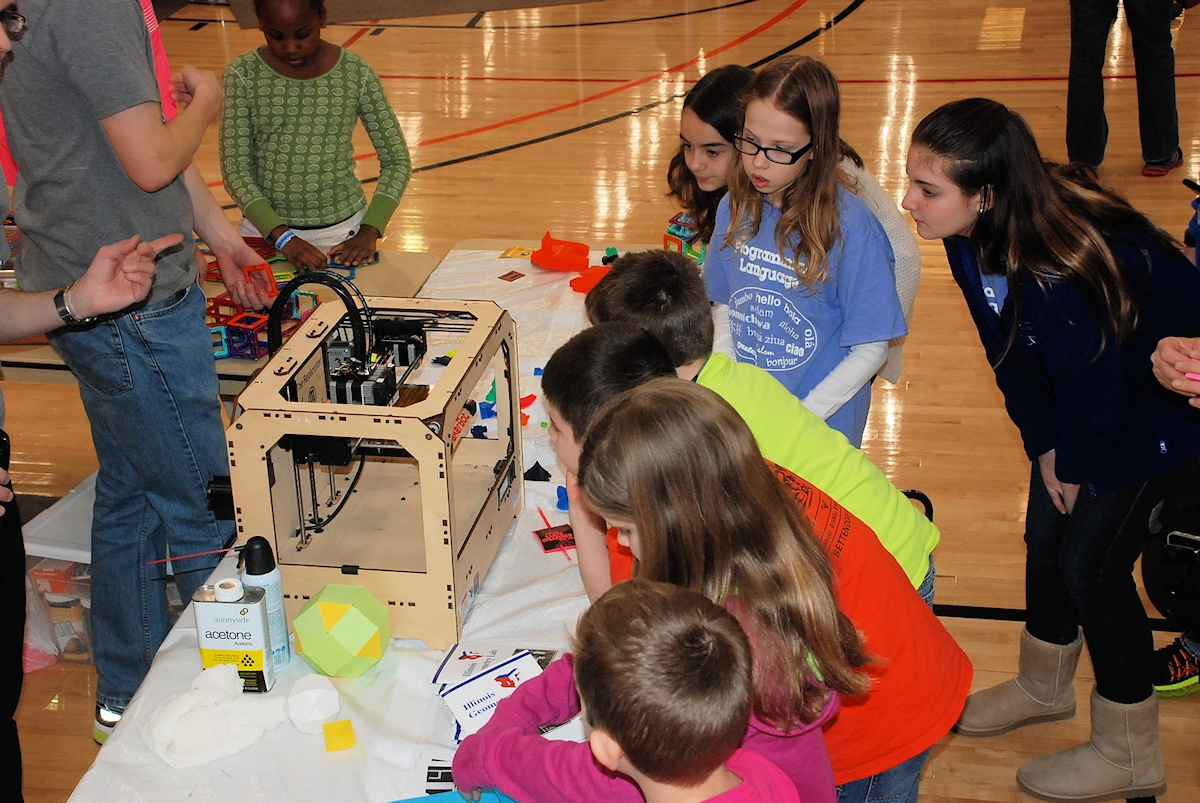 Students gather to watch the MakerBot print on January 24th, 2015 during Lego League. 