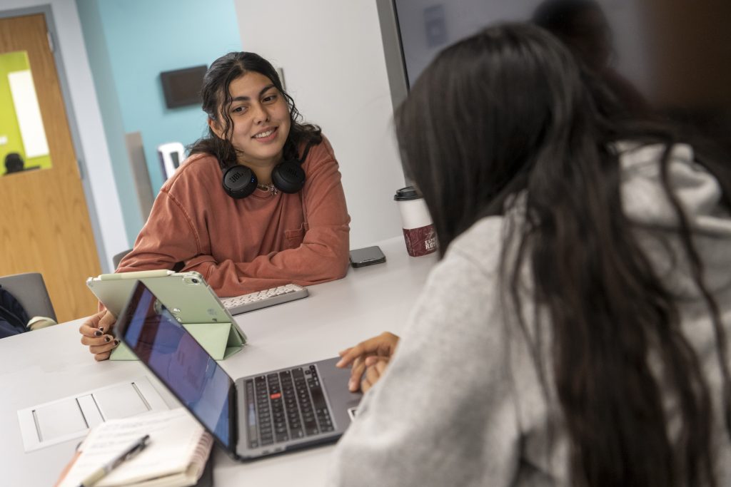 Students working with a laptop