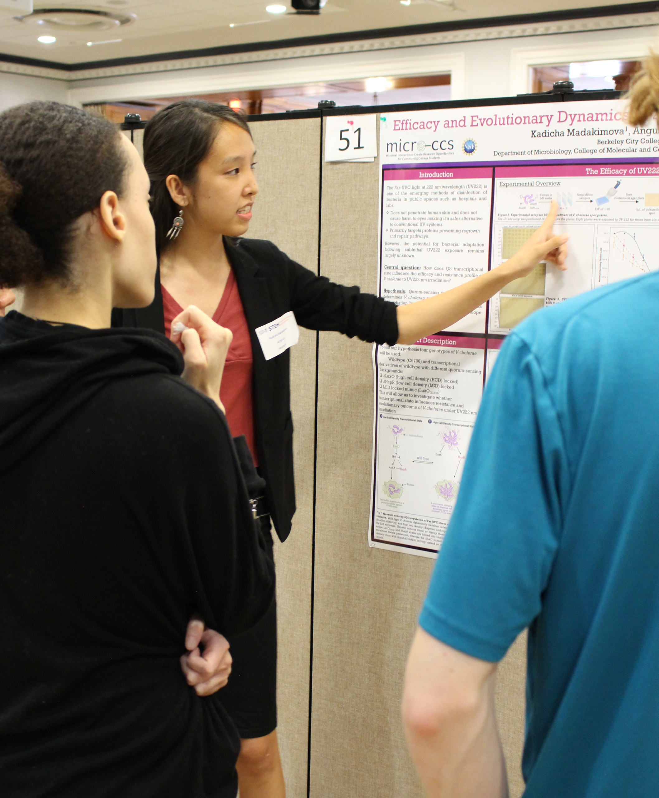 student with research poster