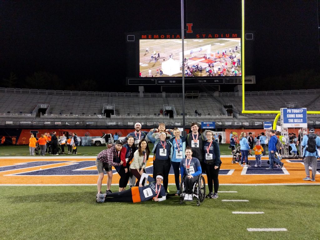 Photo of Team Awesome in Memorial Stadium after 5K