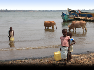 Three African children gathering water.