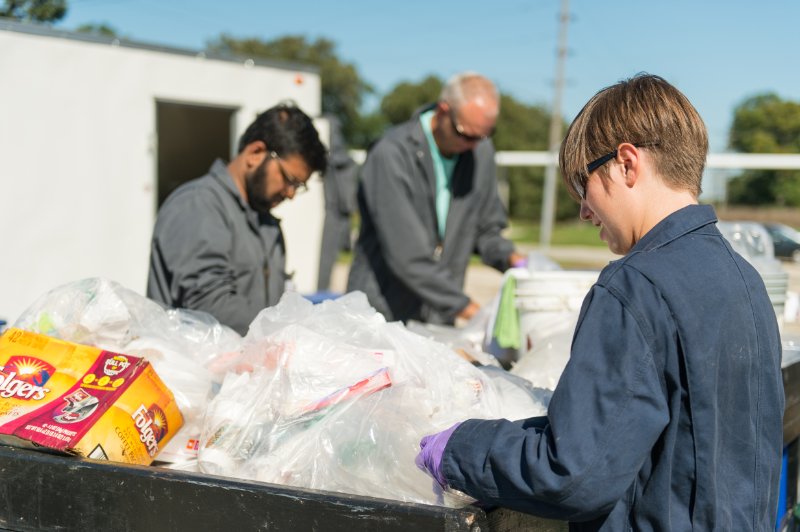Photo of ISTC staff sorting waste