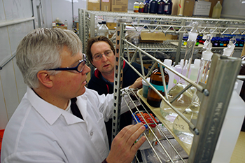 Lance Schideman, research scientist, and John Scott, senior analytical chemist, review chemical stocks
