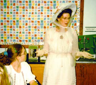 J. Mari Metz in costume as Beatrix Potter in a classroom