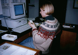 Erin Leslie sits at a computer