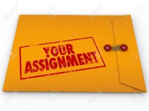 24833708-Your-Assignment-words-in-stamp-on-yellow-envelope-containing-secret-plans-and-instructions-for-your-Stock-Photo