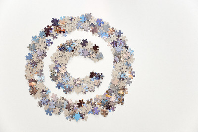 copyright symbol made up of puzzle pieces