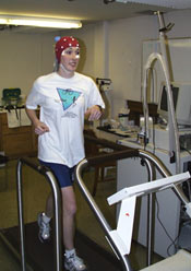 A participant of a research study running on a treadmill