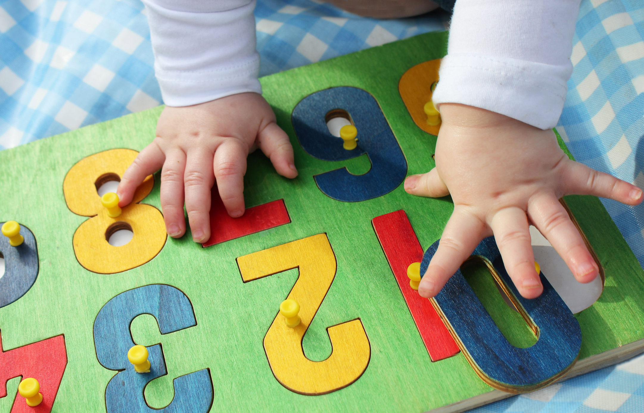 a child playing with a number puzzle