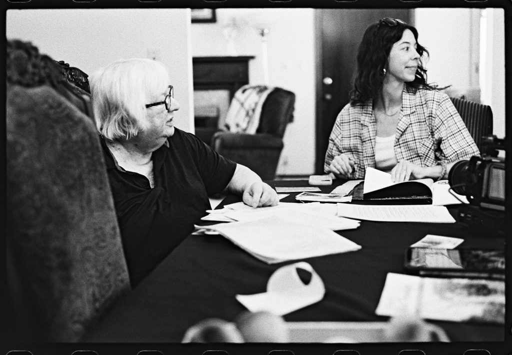 Black and white photo of Jordan Woodward about to conduct an oral history with Gail Thomas