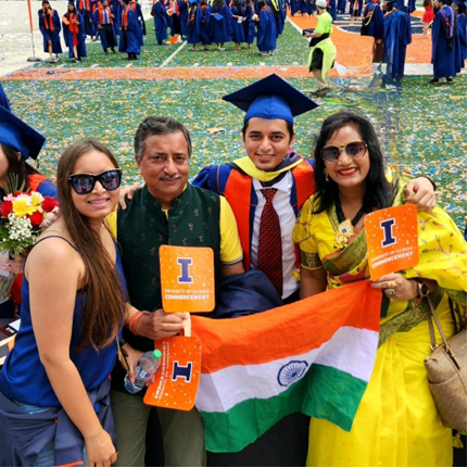 Aradhya's family of four celebrating at U of I graduation. 
