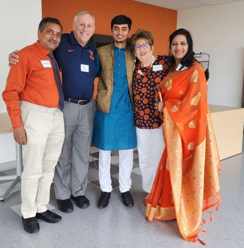 Image of Aradhya with family and people from the iSchool. 