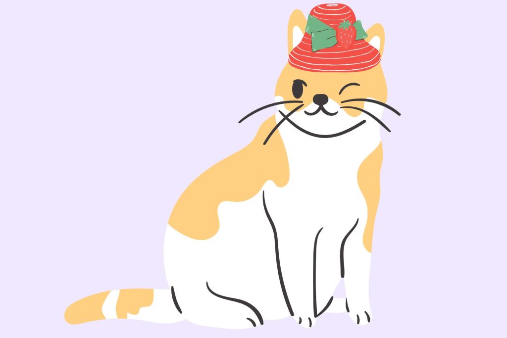 A winking cat wearing a strawberry hat.