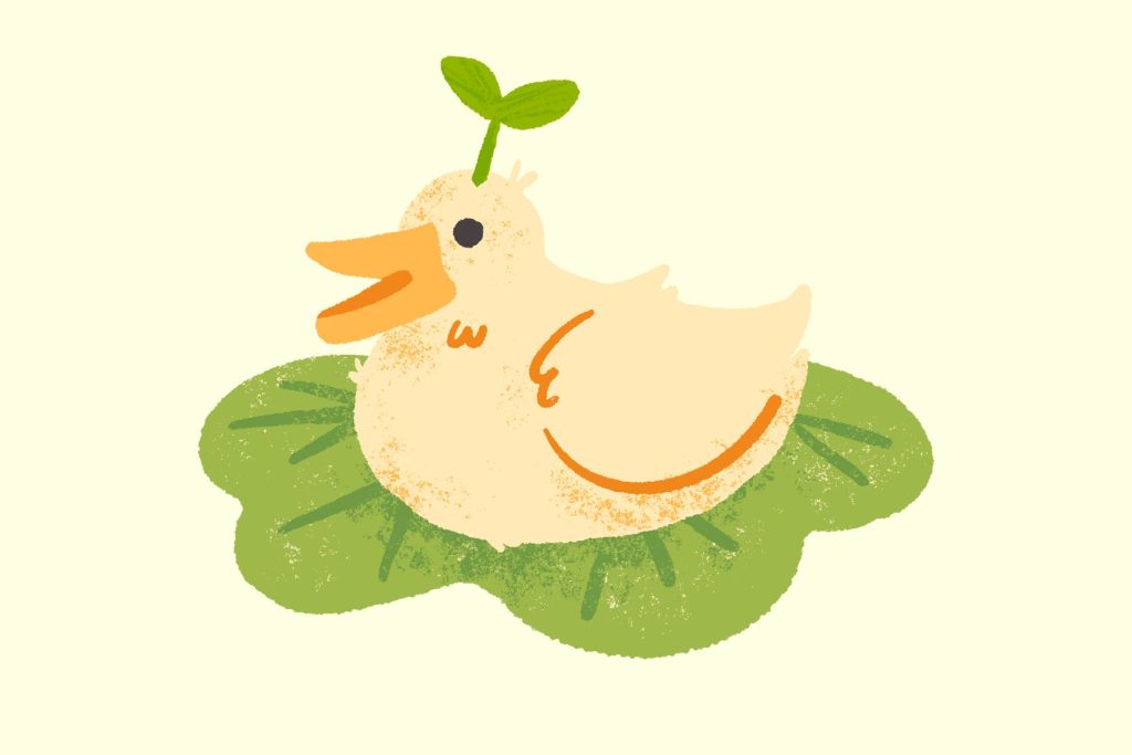 A duck with a sprout on its head, sitting on a lily pad.