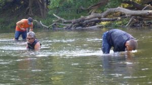 3 people wading in Salt Fork of Vermilion River.