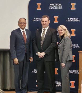 John Dallesasse poses with Dean Bashir and ECE Department Head Bernhard at the award ceremony where he is awarded the title of Gregory E. Stillman Professor
