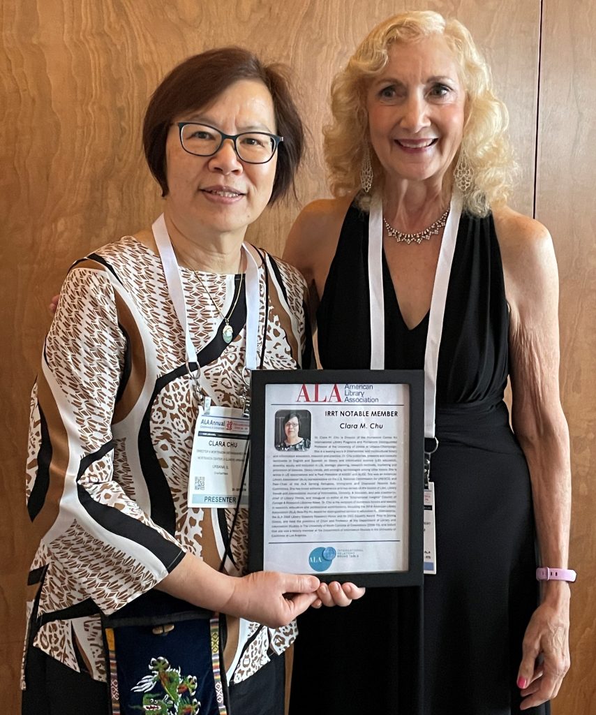 Clara Chu holds IRRT Notable Member plaque, with Carol Brey-Casiano