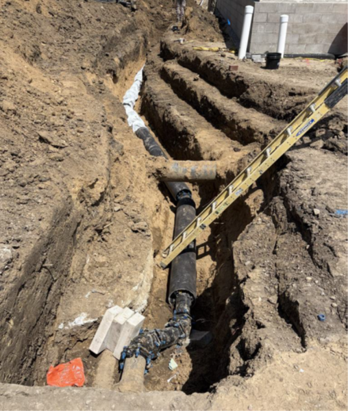 Water line work at west side of building.