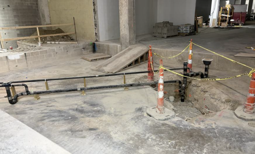 Plumbing installed at recessed floor in south mechanical room.