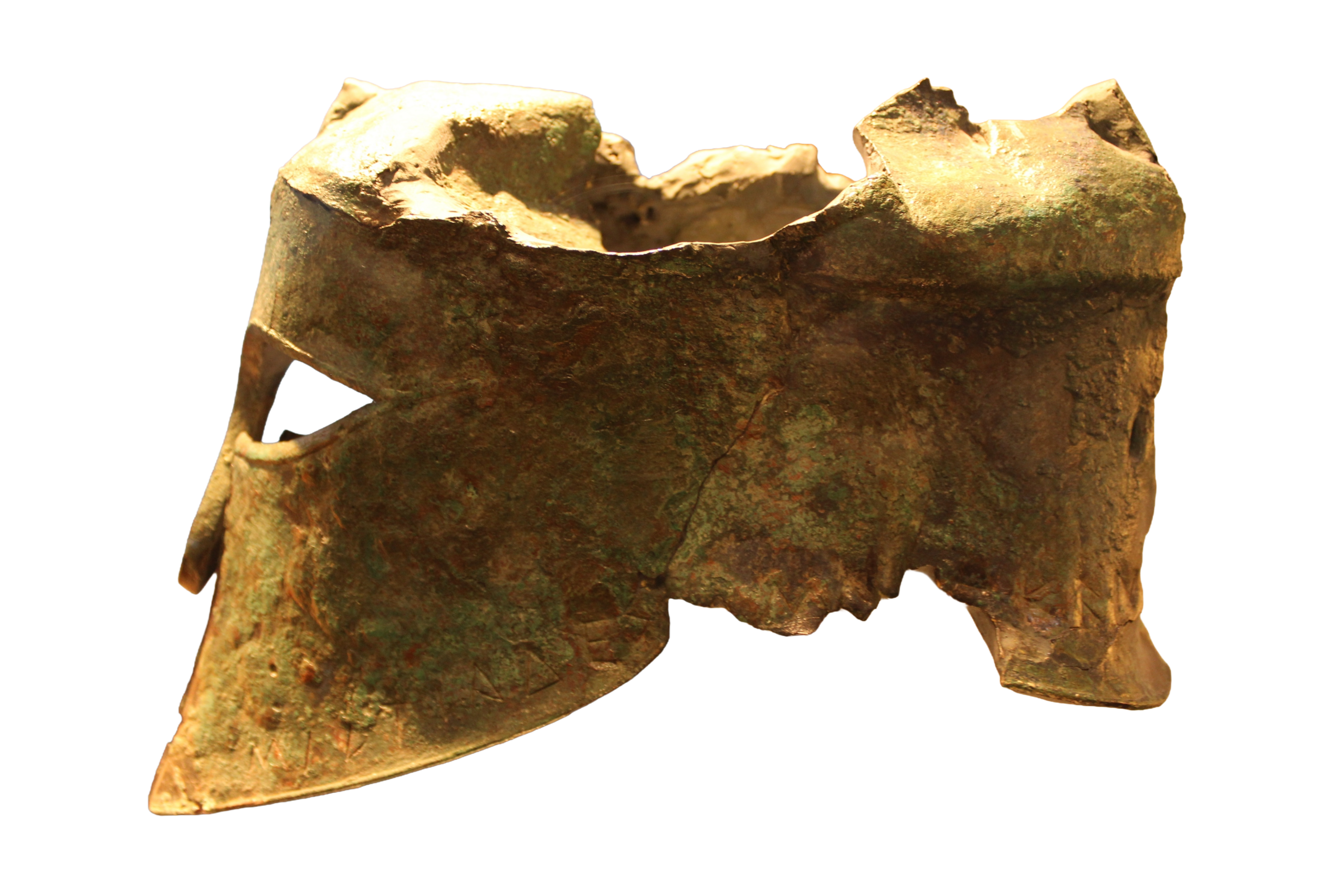 A bronze helmet in the Corinthian style from the early 5th century BCE. The top has eroded.